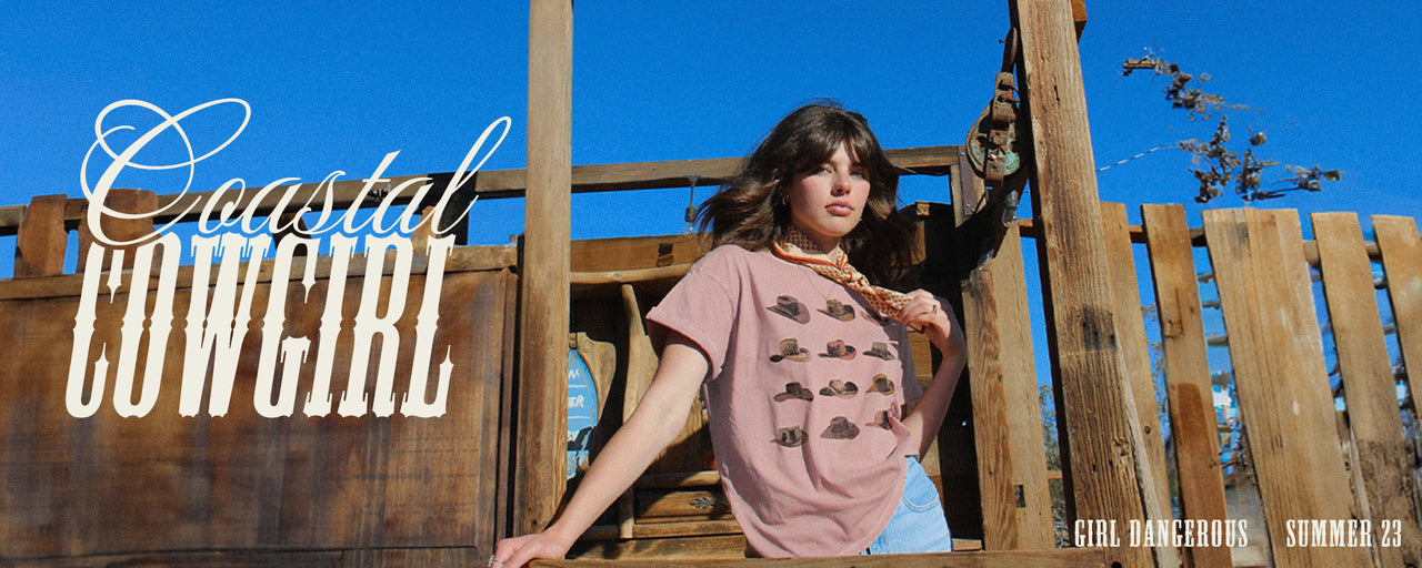 Female wearing our pink cowboy hat dusty pink boyfriend tee. Photo links to our coastal cowgirl collection.